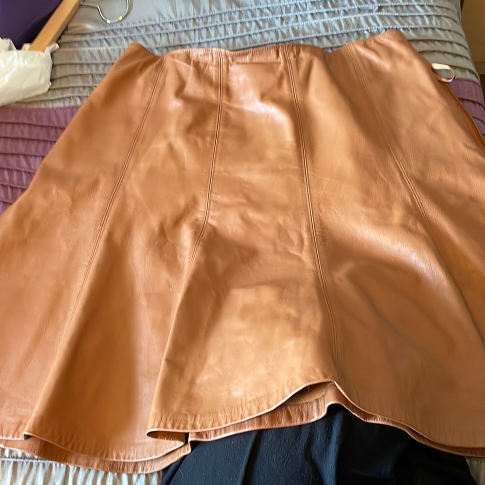 Saddle color faux leather skirt.